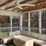 Screened porch with sofa and fan